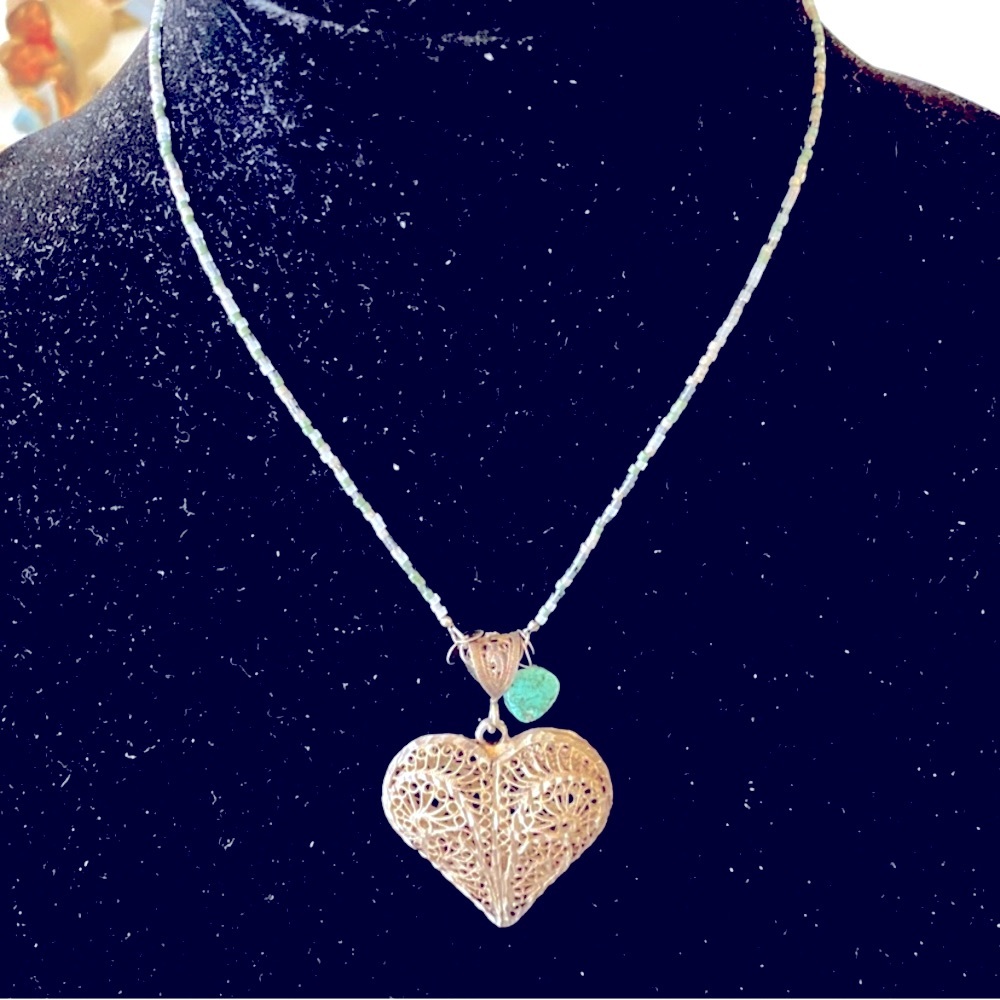 Sterling silver large heart pendant with a simple beaded chain.